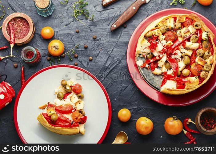 Appetizing tart with cheese,peppers and olives.Flat lay. Cheese pie with peppers and olives.