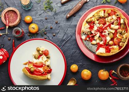 Appetizing tart with cheese,peppers and olives.Flat lay. Cheese pie with peppers and olives.