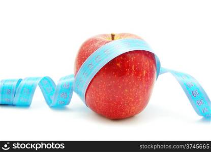 apple and measuring tape on white
