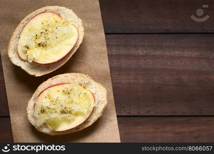 Apple and sauerkraut sandwich seasoned with black pepper, photographed overhead with natural light (Selective Focus, Focus on the top of the sandwiches)