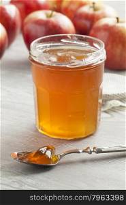 Apple cider jam on a spoon