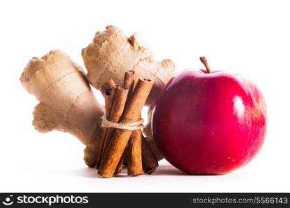 Apple, cinnamon and ginger isolated on white