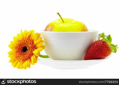 apple in a cup, strawberry and flower isolated on white