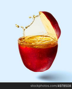Apple juice. Image of juicy apple in splashes. Refreshing and healthy