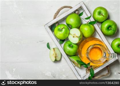 Apple juice in a glass jar with fresh apples. On rustic background .. Apple juice in a glass jar with fresh apples.