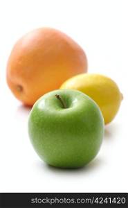 apple, lemon and grapefruit on white background