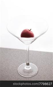 apple martini in a glass on a white background