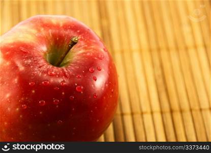 apple on a bamboo mat