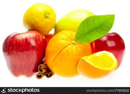 apple, orange, lemon and cinnamon, isolated on white