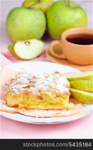 Apple pie on plate with spoon and cup, fruits and pink placemat on background