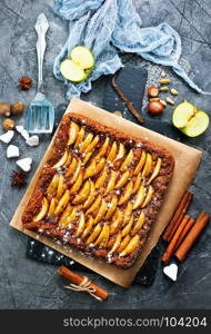 apple pie with cinnamon on a table