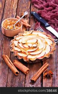 apple pie with cinnamon on a table