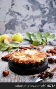 apple pie with cinnamon on a table