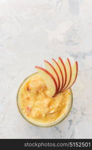 Apple smoothie on a white. Apple smoothie on a white concrete background