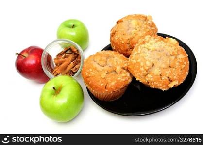 Apple Spice muffins on a white background with 2 green granny smith, one red apple and cinnamon sticks. Apple Spice Muffin