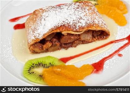 Apple strudel. Apple strudel with fruits and sauce