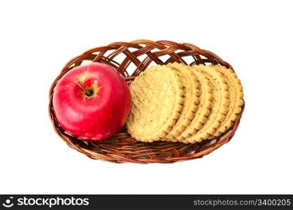 apples and biscuit in basket isolated on a white