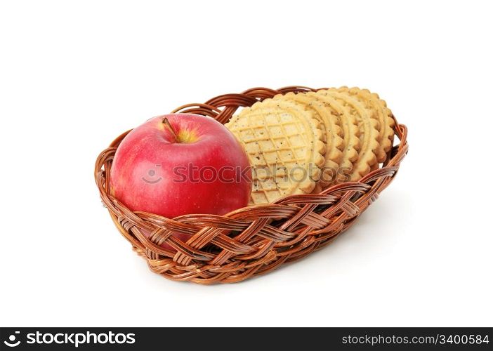 apples and biscuit in basket isolated on a white