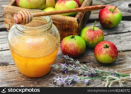 Apples and honey. Fragrant summer apples and jar of honey