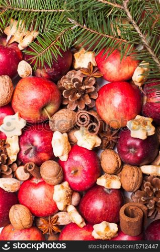 Apples, cones, nuts and cookies with spices. Aroma Christmas