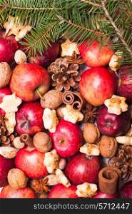 Apples, cones, nuts and cookies with spices. Aroma Christmas