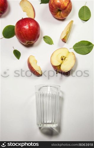 apples for juicing. Fresh apple juice flowing from apple piece into the glass