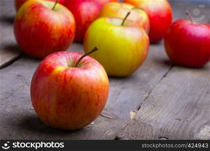 apples in a basket on a wooden table