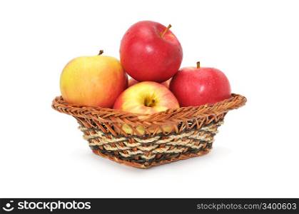 apples in basket isolated on a white