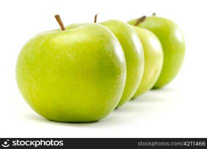 apples in row isolated on white