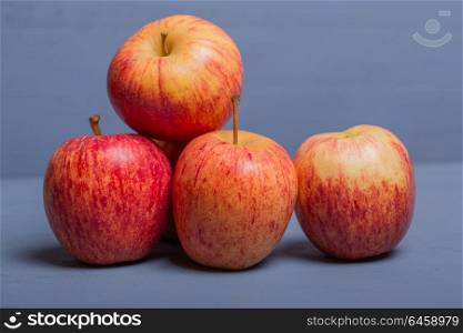 apples on a blue wooden table, studio picture
