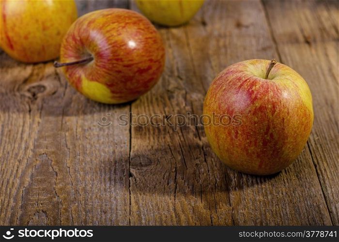 apples on a wooden table.