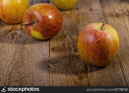 apples on a wooden table.