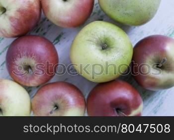 Apples on wooden background. some apples lie on a wooden background. Shooting from the top