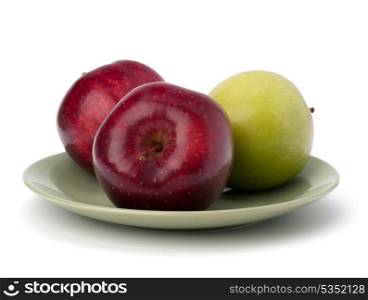 Apples pile on plate isolated on white background
