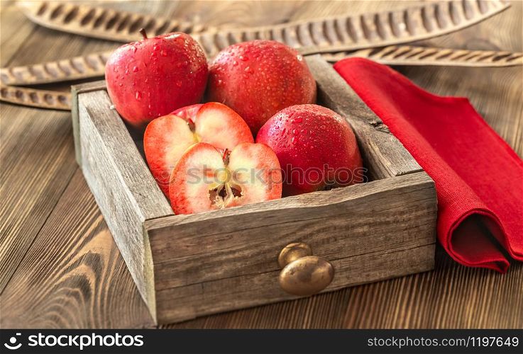 Apples With Red Flesh in the wooden box