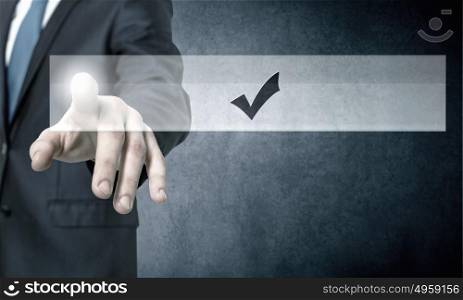 Application icon. Close up of businessman hand touching icon with finger