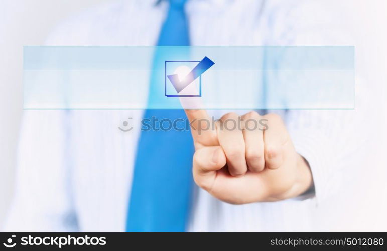 Application icon. Close up of businessman hand touching icon with finger