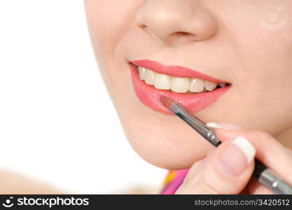 applying liquid glossy lipstick using special brush. applying liquid glossy lipstick