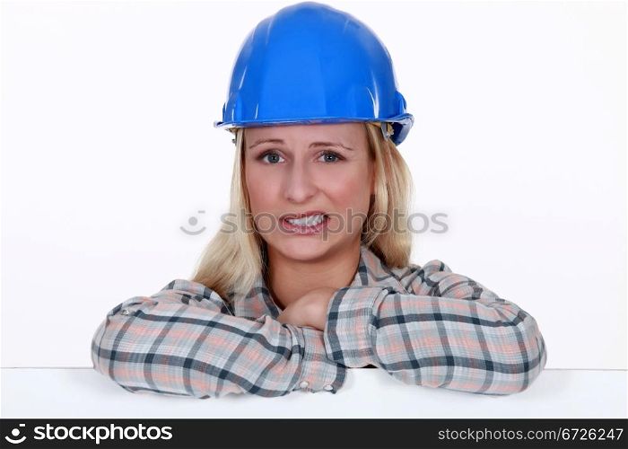 Apprehensive female builder