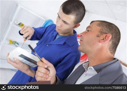 apprentice learning the trade with his teacher