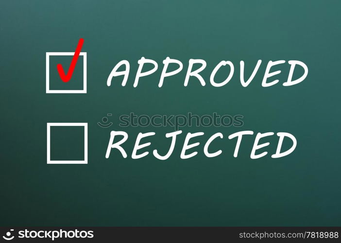 Approved and rejected check boxes on a green chalkboard,with approved ticked
