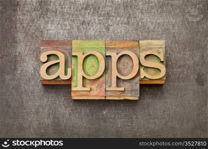 apps (applications) - software concept - text in vintage letterpress wood type against grunge metal surface