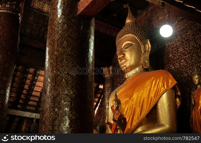 APR 5 Luang Prabang, Laos -Beautiful old golden Buddha statue hall with mural art painting at Wat Xieng thong,
