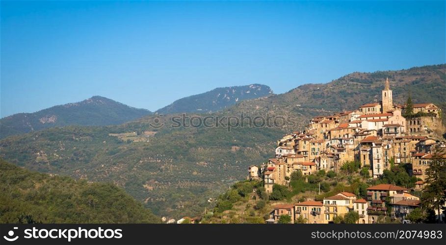 APRICALE, ITALY - CIRCA AUGUST 2020: traditional old village made of stones located in Italian Liguria region with blue sky and copyspace