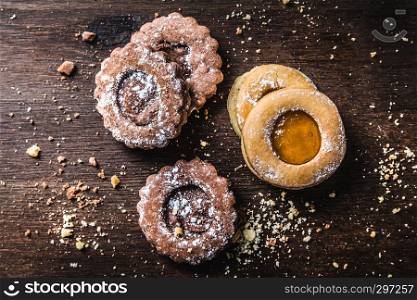 apricot and chocolate biscuits on a dark background, top view
