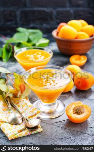 apricot jam in glass bowl and on a table