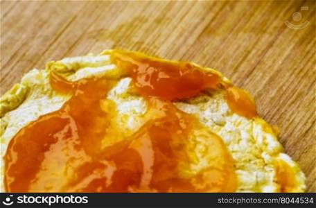 Apricot jam over quinoa toast, close up, horizontal image