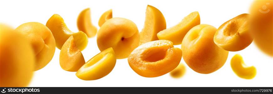 Apricots levitate on a white background. Ripe fruit in flight.. Apricots levitate on a white background. Ripe fruit in flight