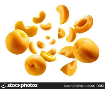 Apricots levitate on a white background. Ripe fruit in flight.. Apricots levitate on a white background. Ripe fruit in flight