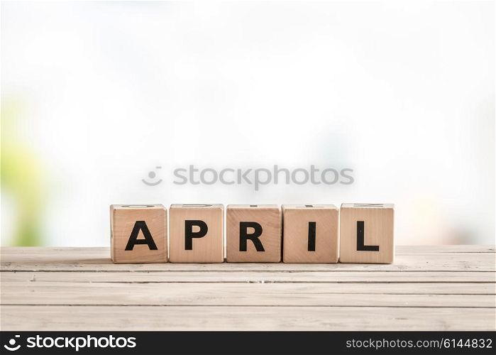 April sign with wooden cubes in the spring